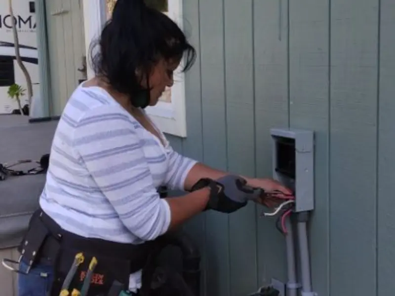 Licensed electrician wiring an exterior subpanel in Cheviot