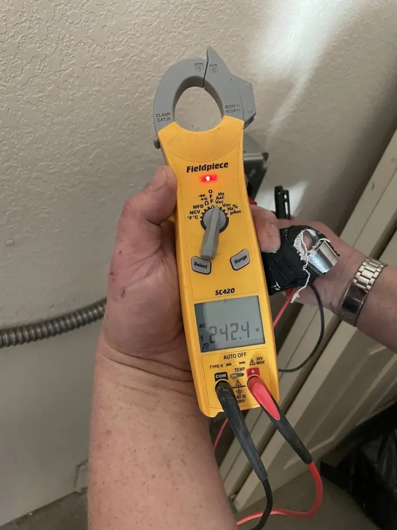 Voltage testing with clamp meter during Ceiling Fan Installation in Cheviot